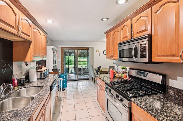 71 Ruggles Ct, Orland Park, IL 60467 - kitchen featuring appliances with stainless steel finishes, light tile patterned flooring, dark stone counters, and recessed lighting