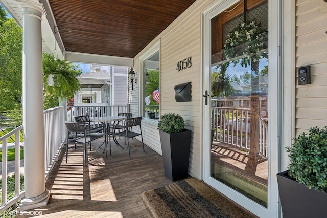4058 N Kostner Ave, Chicago, IL 60641 - wooden porch featuring outdoor dining space