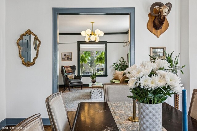 4058 N Kostner Ave, Chicago, IL 60641 - dining area featuring a chandelier and crown molding