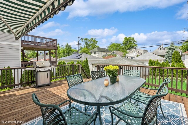 4058 N Kostner Ave, Chicago, IL 60641 - wooden terrace with outdoor dining space, area for grilling, and a residential view