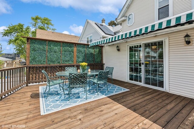 4058 N Kostner Ave, Chicago, IL 60641 - wooden terrace with outdoor dining area