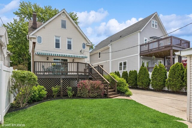 4058 N Kostner Ave, Chicago, IL 60641 - rear view of property featuring a yard, a chimney, and a deck