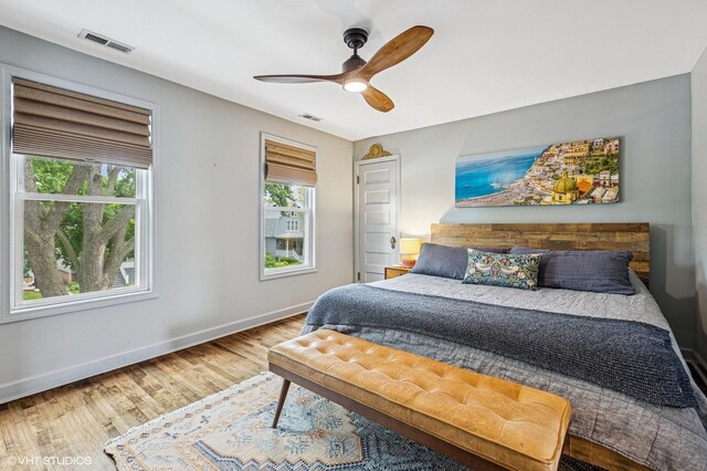 4058 N Kostner Ave, Chicago, IL 60641 - bedroom with baseboards, wood finished floors, and a ceiling fan
