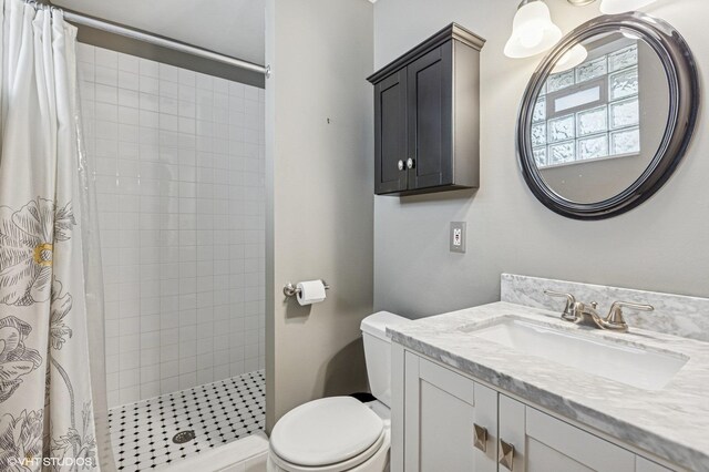 4058 N Kostner Ave, Chicago, IL 60641 - full bathroom with toilet, vanity, and tiled shower