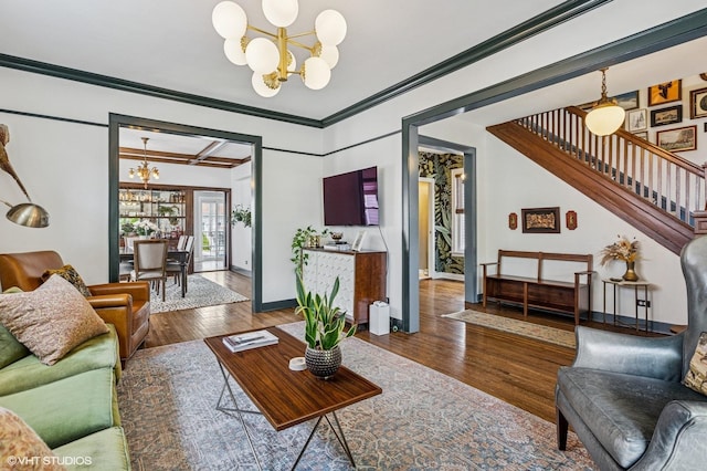4058 N Kostner Ave, Chicago, IL 60641 - living area featuring a chandelier, stairway, wood finished floors, crown molding, and baseboards