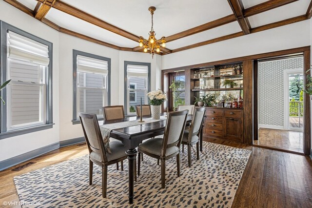 4058 N Kostner Ave, Chicago, IL 60641 - dining space featuring coffered ceiling, a chandelier, wood finished floors, baseboards, and beam ceiling