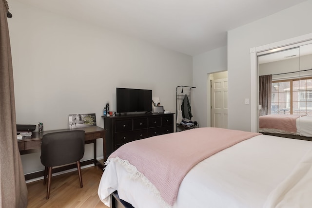 5331 S Harper Ave Unit 1, Chicago, IL 60615 - bedroom with light wood finished floors, an office area, and access to outside
