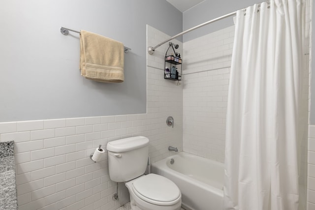 5331 S Harper Ave Unit 1, Chicago, IL 60615 - full bathroom featuring tile walls, shower / tub combo, and a wainscoted wall