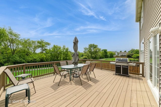 251 Boulder Ct, Gilberts, IL 60136 - deck with outdoor dining space, view of scattered trees, and grilling area