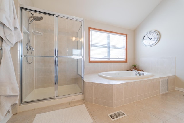 13119 Millbank Dr, Plainfield, IL 60585 - full bathroom featuring tile patterned flooring, a bath, a stall shower, and vaulted ceiling