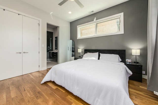 1411 W Huron St Unit 2, Chicago, IL 60642 - bedroom with light wood-type flooring, ensuite bath, recessed lighting, a ceiling fan, and a closet