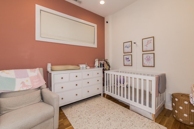 1411 W Huron St Unit 2, Chicago, IL 60642 - bedroom with a crib and wood finished floors