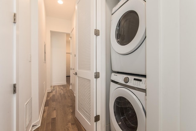 1411 W Huron St Unit 2, Chicago, IL 60642 - washroom featuring stacked washer / dryer, dark wood finished floors, and baseboards