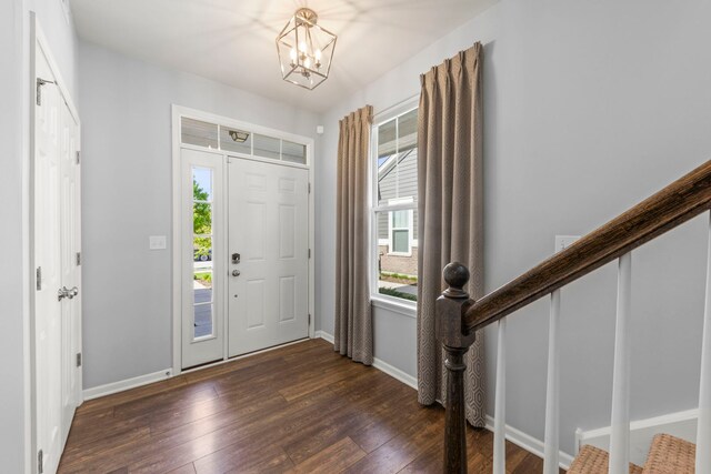 27W120 Timber Creek Dr, Winfield, IL 60190 - foyer entrance with dark wood-type flooring, baseboards, a chandelier, and stairs