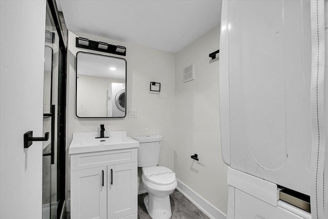 1829 S Kedzie Ave, Chicago, IL 60623 - full bathroom featuring toilet, baseboards, vanity, washer / dryer, and a shower