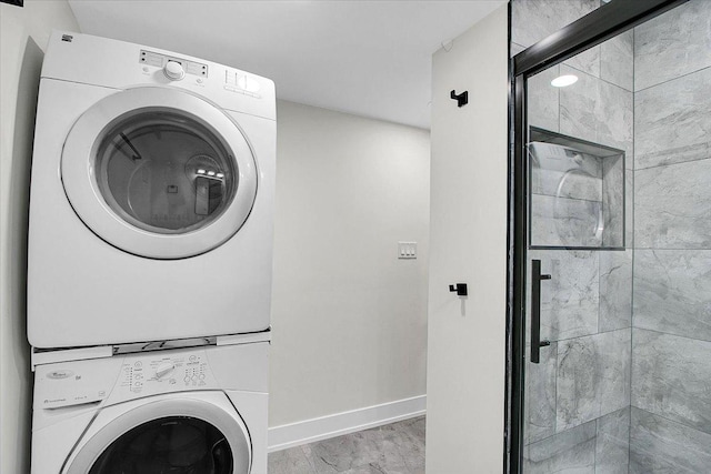 1829 S Kedzie Ave, Chicago, IL 60623 - laundry room featuring estacked washer and dryer, baseboards, and marble finish floors