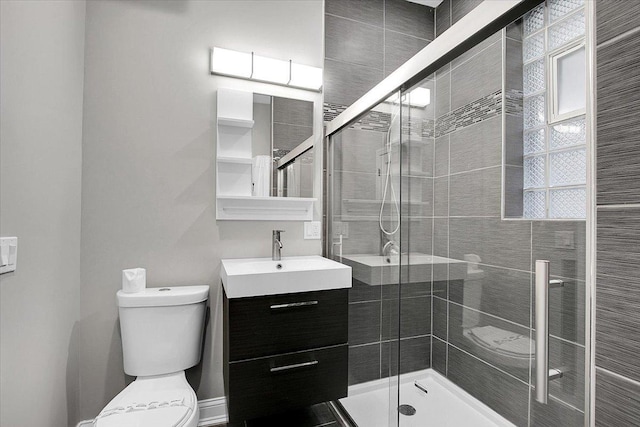 1829 S Kedzie Ave, Chicago, IL 60623 - bathroom featuring toilet, vanity, and a stall shower