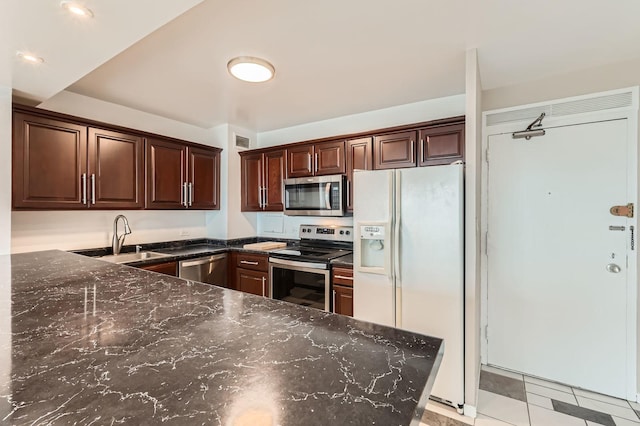 3600 N Lake Shore Dr Unit 1518, Chicago, IL 60613 - kitchen with stainless steel appliances, a sink, dark stone countertops, and dark brown cabinets