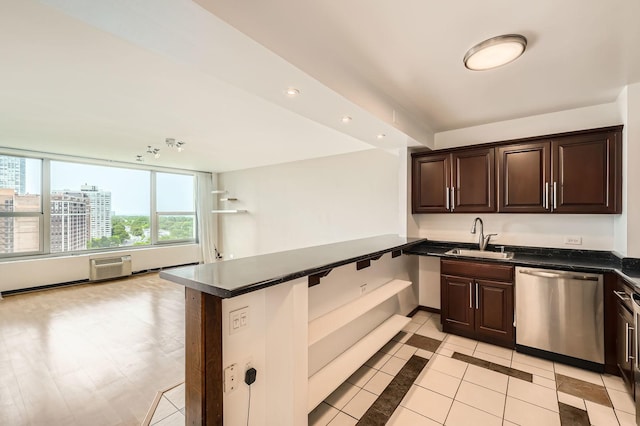 3600 N Lake Shore Dr Unit 1518, Chicago, IL 60613 - kitchen featuring stainless steel dishwasher, a sink, dark countertops, dark brown cabinetry, and a peninsula