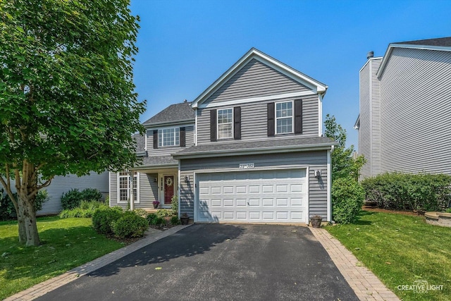 39W382 W Mallory Dr, Geneva, IL 60134 - traditional home with asphalt driveway, a garage, and a front yard