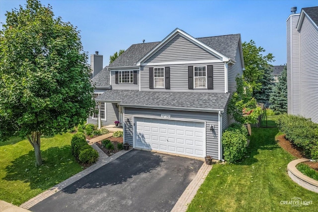 39W382 W Mallory Dr, Geneva, IL 60134 - traditional-style home featuring roof with shingles, asphalt driveway, and a garage