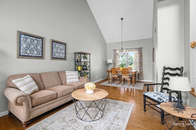 39W382 W Mallory Dr, Geneva, IL 60134 - living area with high vaulted ceiling, a chandelier, and wood finished floors