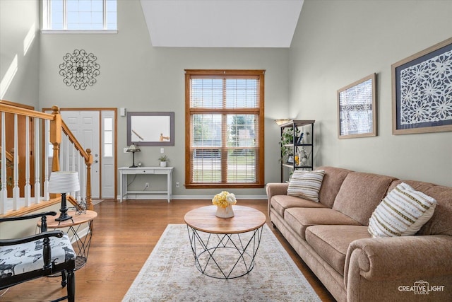 39W382 W Mallory Dr, Geneva, IL 60134 - living area featuring wood finished floors, stairs, and a towering ceiling