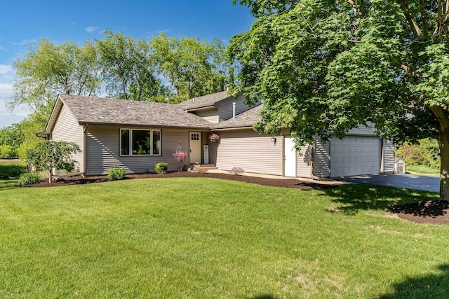 7812 Rhonda Dr, Roscoe, IL 61073 - view of front of house featuring asphalt driveway, a front lawn, roof with shingles, and an attached garage