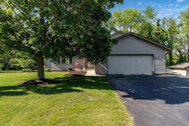 7812 Rhonda Dr, Roscoe, IL 61073 - view of front of property with asphalt driveway and a front lawn