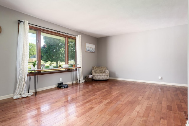 7812 Rhonda Dr, Roscoe, IL 61073 - living area featuring hardwood / wood-style floors and baseboards