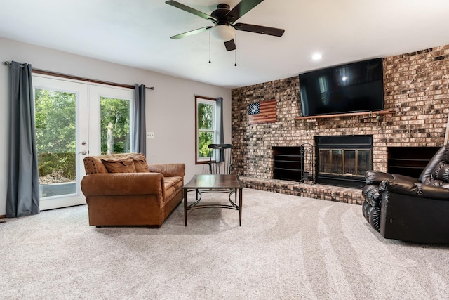 7812 Rhonda Dr, Roscoe, IL 61073 - carpeted living room with a brick fireplace, french doors, and a ceiling fan
