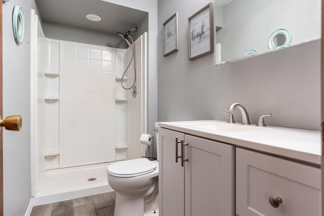 7812 Rhonda Dr, Roscoe, IL 61073 - bathroom featuring toilet, vanity, a shower, and wood finished floors