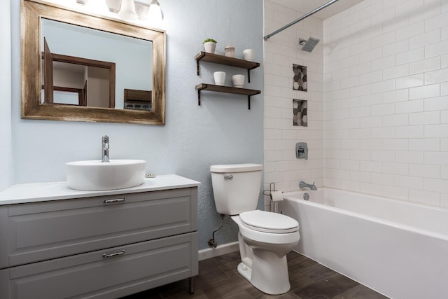 7812 Rhonda Dr, Roscoe, IL 61073 - bathroom with toilet, vanity, wood finished floors,  shower combination, and baseboards