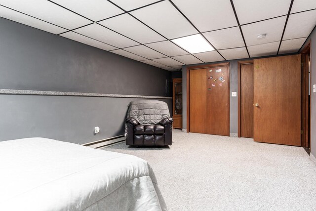 7812 Rhonda Dr, Roscoe, IL 61073 - carpeted bedroom featuring baseboard heating, a paneled ceiling, and baseboards
