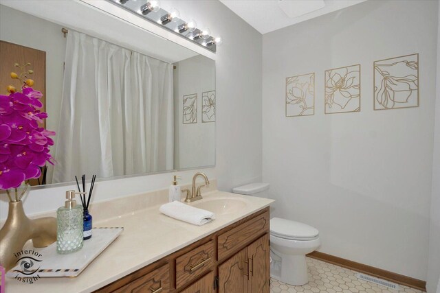 17932 S Alaska Ct Unit 21, Orland Park, IL 60467 - full bathroom with toilet, double vanity, and tile patterned flooring