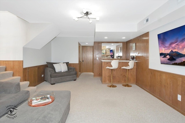 17932 S Alaska Ct Unit 21, Orland Park, IL 60467 - living room with wooden walls, wainscoting, light colored carpet, and bar area