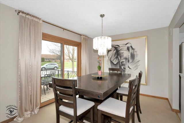17932 S Alaska Ct Unit 21, Orland Park, IL 60467 - dining space with a chandelier, baseboards, and light carpet