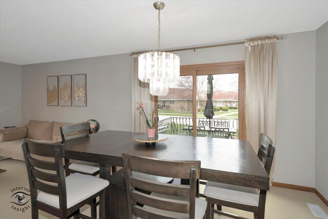 17932 S Alaska Ct Unit 21, Orland Park, IL 60467 - dining room featuring a chandelier and baseboards