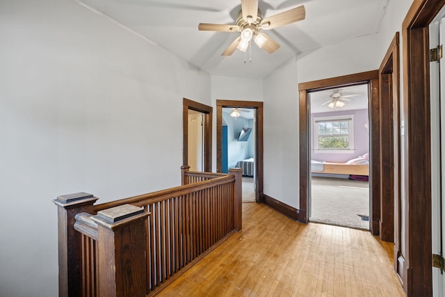 13805 Sharp Dr, Plainfield, IL 60544 - hallway featuring light wood-style floors, an upstairs landing, vaulted ceiling, and baseboards