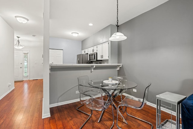 266 Sierra Pass Dr, Schaumburg, IL 60194 - dining space featuring baseboards, wood-type flooring, and recessed lighting