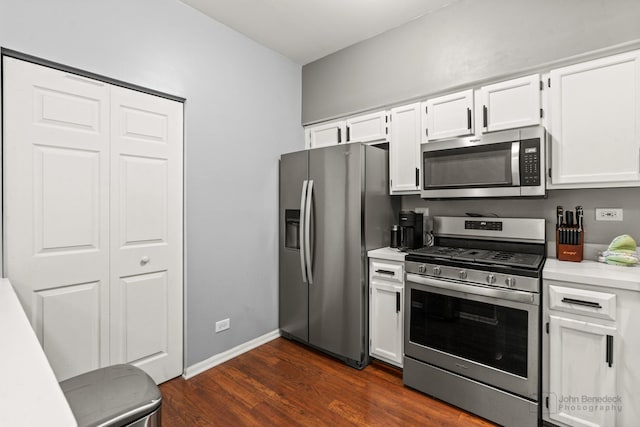 266 Sierra Pass Dr, Schaumburg, IL 60194 - kitchen with stainless steel appliances, light countertops, white cabinets, dark wood-type flooring, and baseboards