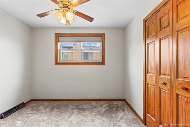 9144 S Trumbull Ave, Evergreen Park, IL 60805 - unfurnished bedroom with carpet, baseboards, and ceiling fan