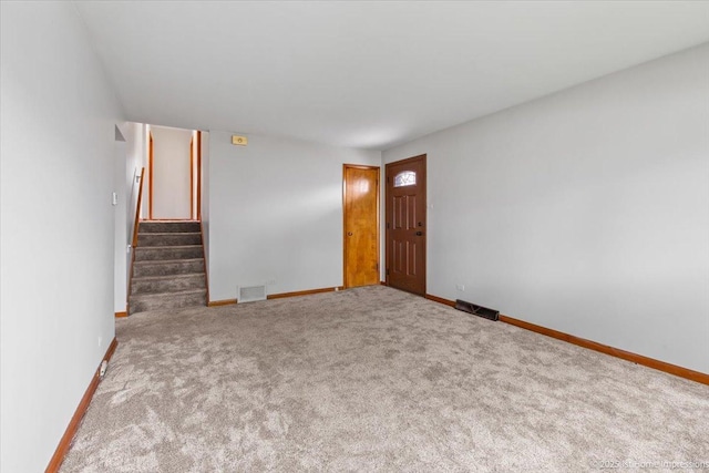 9144 S Trumbull Ave, Evergreen Park, IL 60805 - carpeted empty room with baseboards and stairway