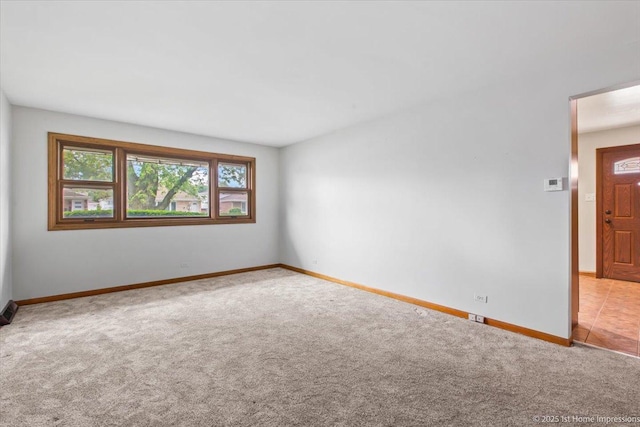 9144 S Trumbull Ave, Evergreen Park, IL 60805 - carpeted empty room featuring baseboards