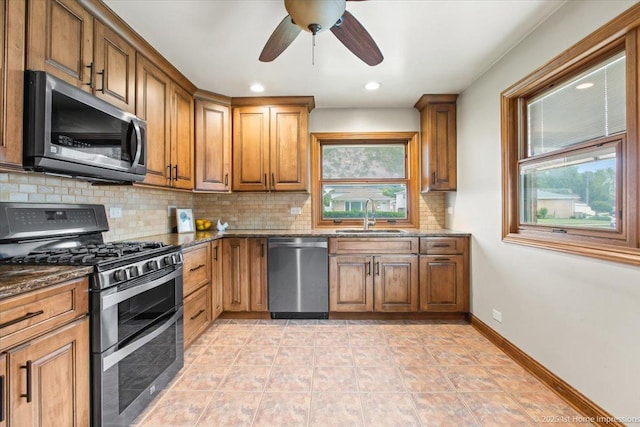 9144 S Trumbull Ave, Evergreen Park, IL 60805 - kitchen with appliances with stainless steel finishes, backsplash, a sink, healthy amount of natural light, and recessed lighting