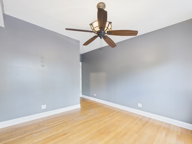 2609 W Rosemont Ave Unit C, Chicago, IL 60659 - spare room featuring baseboards, light wood-type flooring, and a ceiling fan
