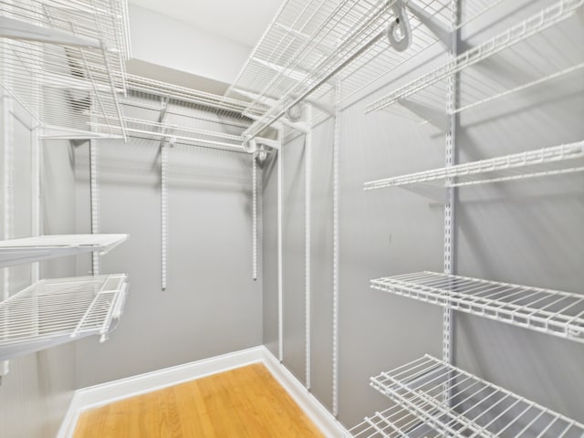 2609 W Rosemont Ave Unit C, Chicago, IL 60659 - walk in closet with wood finished floors