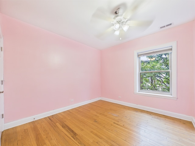 2609 W Rosemont Ave Unit C, Chicago, IL 60659 - unfurnished room featuring baseboards, a ceiling fan, and light wood-style floors