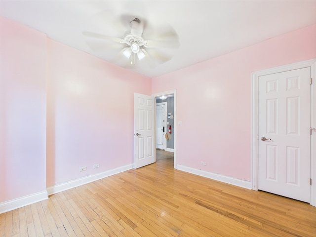 2609 W Rosemont Ave Unit C, Chicago, IL 60659 - unfurnished bedroom featuring light wood-type flooring, baseboards, and ceiling fan