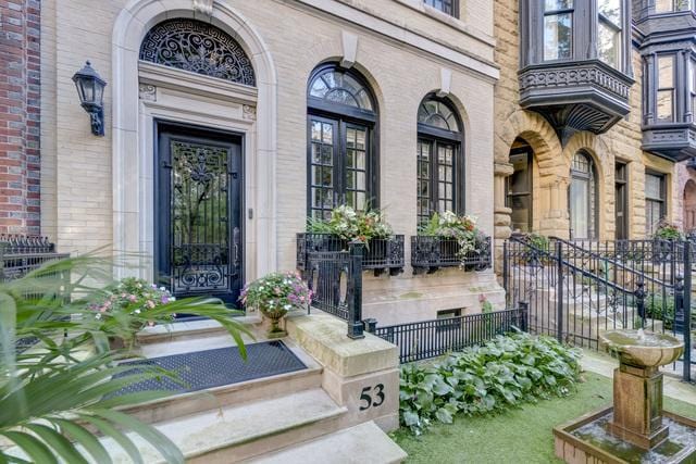 53 E Division St, Chicago, IL 60610 - view of exterior entry featuring a porch